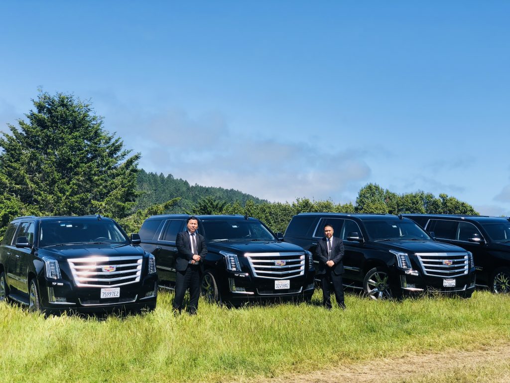 Two MGL Limo Chauffeurs with their Cadillac SUV vehicles