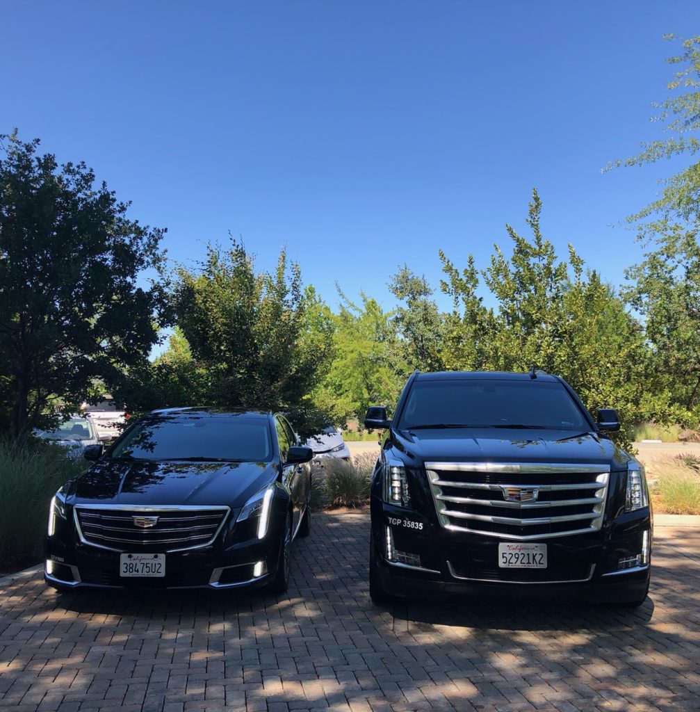 MGL Limo sedans standing in a parking lot