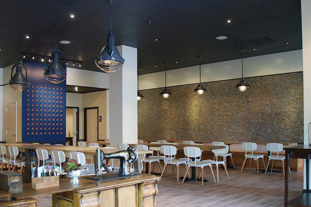 Farm House Kitchen Interior with White Metal Chairs and wood flooring